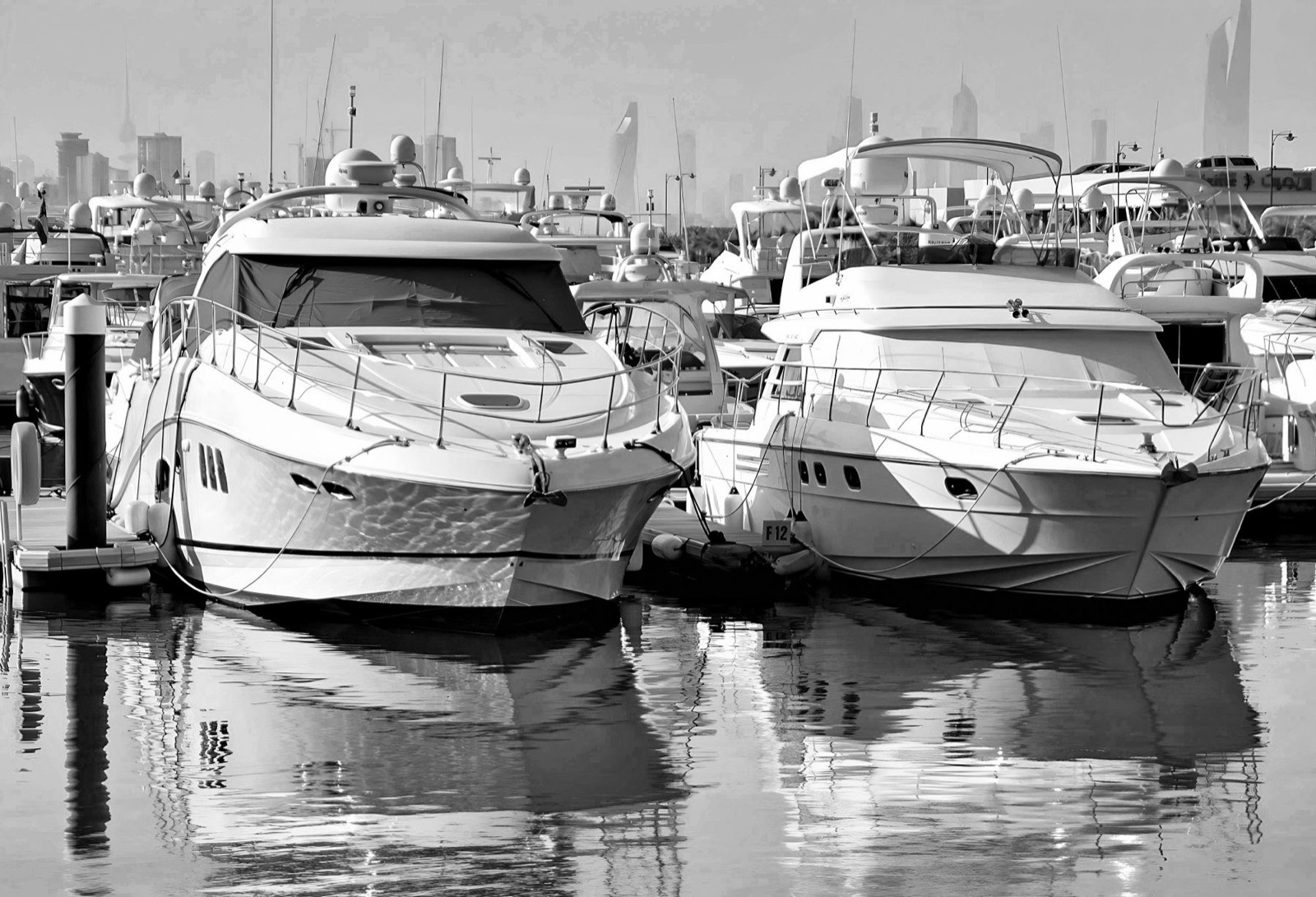 Yachts moored at a marina